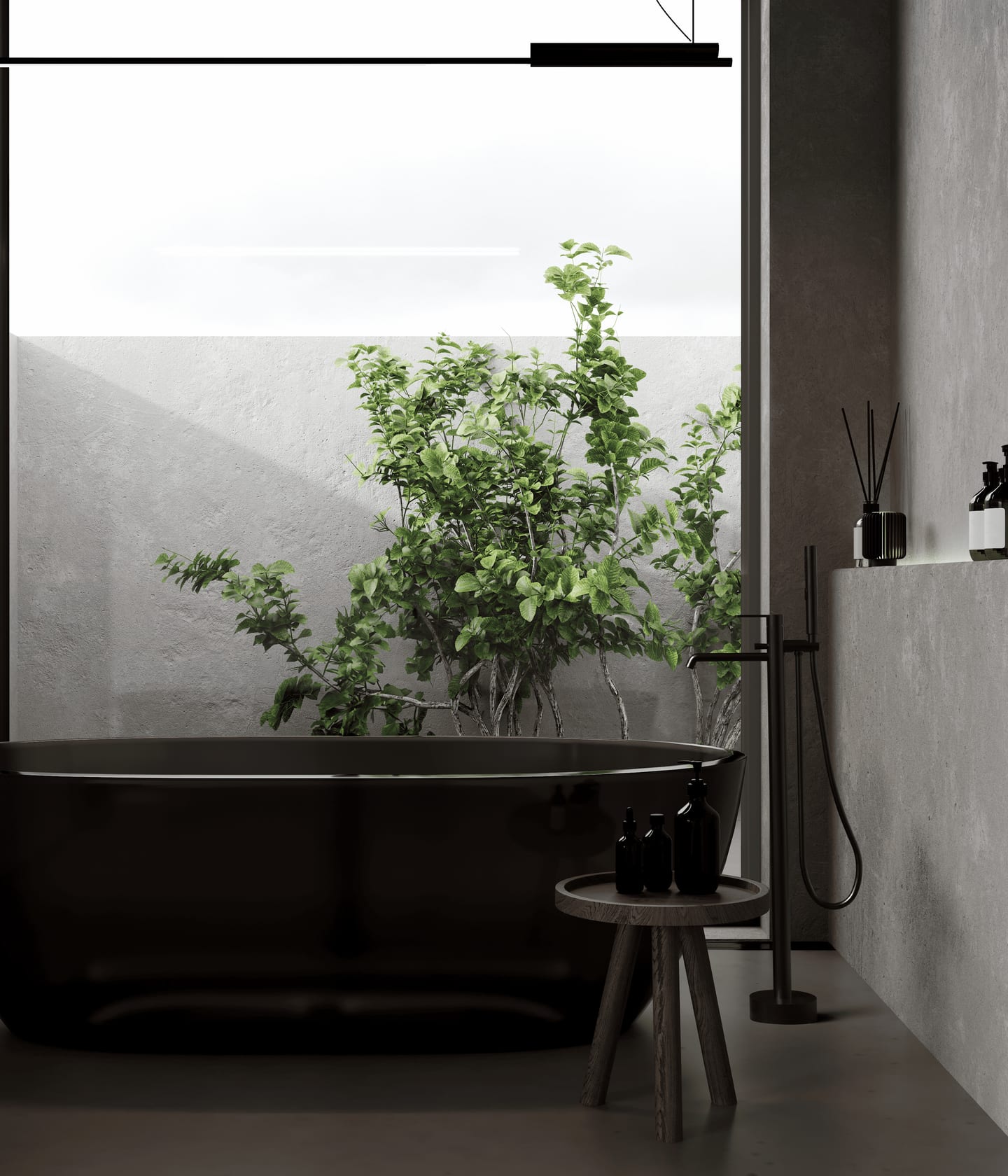 A black freestanding bath and floor-mounted mixer tap in a concrete bathroom, opening onto a planted courtyard